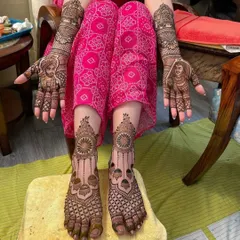 A stunning view of a complete bridal mehendi set, with Sikh couple portraits on the hands and intricate mandala designs on the feet.