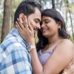 A sweet, intimate moment during a pre-wedding shoot in a serene forest setting. We guide our couples into poses that feel natural and bring out their genuine emotions.