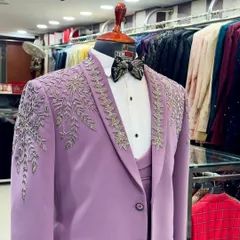 A full view of the handcrafted lavender tuxedo, showcasing the intricate silver embroidery that flows from the shoulders. This is a perfect statement suit for a groom or wedding guest.