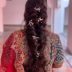 A volumized soft braid for the bride's D-day. I added baby's breath for a touch of elegance. This style is perfect for keeping long hair managed and beautiful.