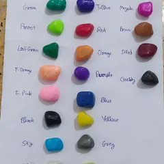 I offer a wide range of polished pebbles in many colors. This chart shows some of the available options, from green and blue to red and black.