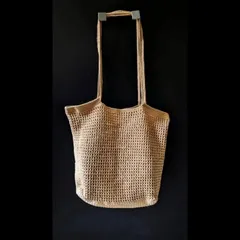 The simple and elegant silhouette of our crochet jhola bag, ready to be taken on the go. We use eco-friendly yarn to create these sustainable fashion pieces.