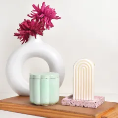 What do you prefer, structural candles or jar candles? We love how this arch candle and daisy jar look together.