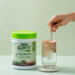 A simple, effective demonstration of the product in use. We show Tata GoFit's plant protein being mixed into a glass of water, highlighting how easily it dissolves.