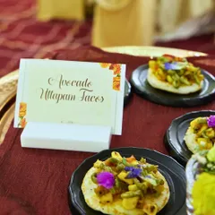 A creative take on a South Indian classic. These Avocado Uttapam Tacos are mini uttapams topped with a fresh and zesty avocado mixture, garnished with edible flowers.