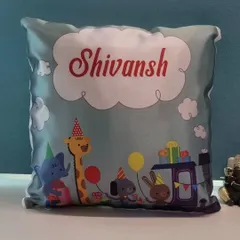 This cute kids' cushion is customized with a party animal train theme and the name "Shivansh," making it a perfect birthday gift.