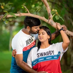 A duplicate of ID 72, this photo captures a tender moment between a couple in a park, showcasing their playful and loving connection.