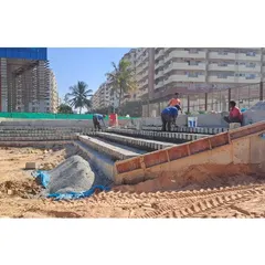 Our team at work constructing the tiered seating at Vaishnavi Tech Park. This image captures the precise formwork and construction required to bring our complex hardscape designs to life in an urban setting.