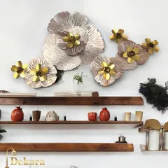 This wall art piece consists of several layered flowers in rose gold and brass finishes. The metallic sheen and three-dimensional design add depth and luxury to any wall.