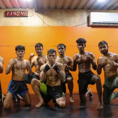 In a fighter's stance, ready for what's next. The physique you see here isn't for show. It's a functional body built for performance, endurance, and combat. We grind to be worthy.