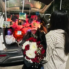 A car trunk or 'dikki' surprise is a unique and fun way to celebrate. I fill the car boot with balloons, flowers, photos, and a "Happy Birthday" banner to create a memorable moment they will never forget.
