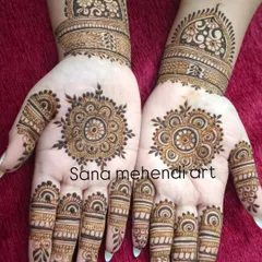 A simple and beautiful design featuring a central mandala on each palm. The fingers have matching detailed bands, and the wrist is adorned with a floral cuff.