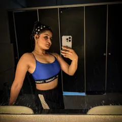 A confident mirror selfie after a great session. My philosophy is about doing what makes you feel strong and powerful, and for me, that's hitting the gym and pushing my limits.