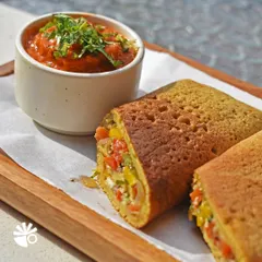 My Besan ka Chilla is a wholesome and savory pancake made from gram flour, stuffed with fresh veggies. Served with a tangy tomato chutney, it's a protein-packed option for breakfast or a quick snack.