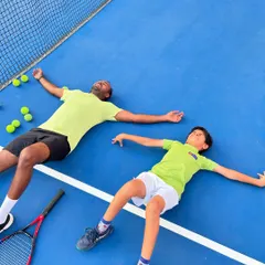 Another shot of a well-deserved break on the court. Fun and hard work go hand in hand at our academy.