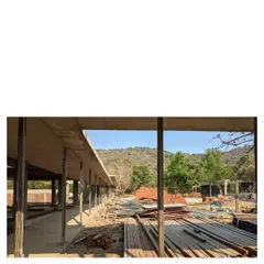 Another view of the family commune under construction in Alibaug. The concrete structure establishes the long, linear form of the homes, which are designed to allow for both privacy and collective living.