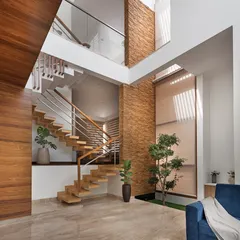 The multi-level staircase in the Cube House is a central feature, visible from the living area. Its open design ensures that light from the skylight above filters down through the different floors of the home.