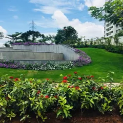 This image highlights our use of tiered retaining walls and sloped lawns to create visual interest and manage elevation changes in a large community space.