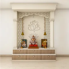 A beautiful wall-mounted pooja unit designed with traditional arches and intricate jali work. The hanging bells and multi-level platform provide ample space for idols and prayer essentials in an elegant, compact form.