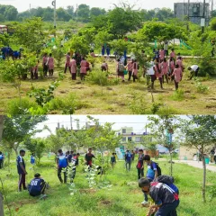 Students from various schools participating in a plantation drive for HCL's Foundation Day. Involving children in corporate CSR events creates a powerful inter-generational connection.