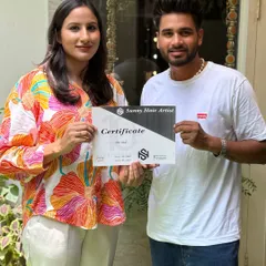Celebrating the successful completion of my intensive hairstyling workshop. This certificate marks the beginning of a new chapter in her professional career.