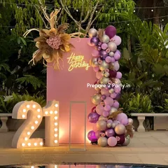 For a chic 21st birthday, I designed this sophisticated outdoor setup by the pool. It combines a modern pink backdrop, a custom neon sign, and an elegant balloon garland with pampas grass and floral arrangements for a trendy, bohemian vibe.
