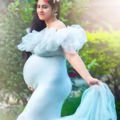 My collection of maternity gowns includes beautiful options like this light blue tulle dress, which flows wonderfully and adds a touch of dreaminess to outdoor pregnancy photos.