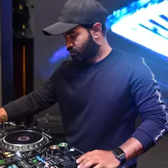 A focused moment during a Saturday night set. I'm constantly concentrating on the mix, reading the crowd, and selecting the next track to maintain the party's momentum.