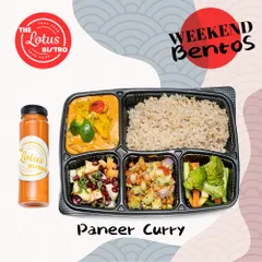 The Paneer Curry Bento is a delicious vegetarian option with soft paneer cubes in a savory curry. It is served with brown rice and a mix of fresh salads to ensure a well-rounded, nutritious meal.