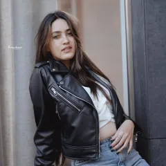 This is an example of my urban portrait work, capturing a relaxed, confident look in a city setting. I use the environment to frame the subject, creating a portrait that feels both candid and professionally styled.