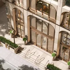 The plaza at Evershine House is an "inclusionary" urban layer, designed to be interactive with street life. This approach contrasts with disconnected, exclusionary buildings, allowing the architecture to celebrate Mumbai's vibrant ground condition and elevate the high-street experience.