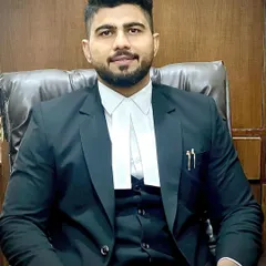Seated in my professional capacity, ready to listen and to fight for you. I believe a lawyer's strength lies in their preparation and their unwavering commitment to their client.