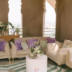 This lounge is giving main character energy. We set up this chic seating area with a stunning city view, using plush beige sofas, pops of lavender, and a modern striped rug to create a sophisticated yet relaxed vibe.
