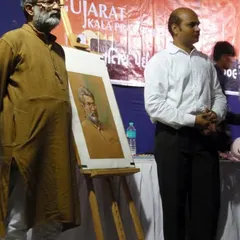 Standing beside my Guru, Shri Vasudevji Kamath, during a live portrait demonstration I conducted in his honor.