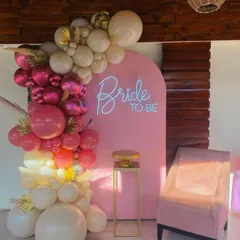 Celebrate the bride-to-be with this trendy and modern photo backdrop. I combined a custom neon sign with a vibrant, multi-toned balloon arch and gold accents to create the perfect spot for pictures and memories.
