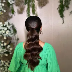 The back of the vintage waves pony, showing the sleek wrap and the beautiful S-shaped waves.