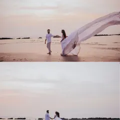 A dreamy, ethereal scene on a Goan beach at dusk. The soft light and the bride's flowing white gown create a magical, almost painterly effect, capturing a moment of pure romance by the sea.