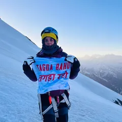 Some people ask if our training builds biceps. We believe it builds the strength to conquer mountains, literally. One of our members holding our flag high after a gruelling climb is proof that this is more than a workout; it's practice for life's biggest challenges.