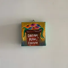 "Dream Plan Execute." This mini canvas painting, with its potted plant design, serves as a visual checklist for achieving your goals.