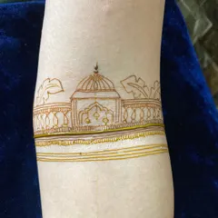 A simple and elegant startup design on the arm, featuring a temple motif. This is a great exercise for practicing clean lines.
