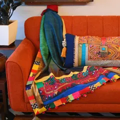 Another view of the vibrant Banjara throw, showcasing its rich colors and textures. This is a perfect example of an upcycled, one-of-a-kind heirloom piece.