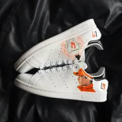 A top-down view of the Lando Norris custom sneakers, showing the artwork on both shoes.
