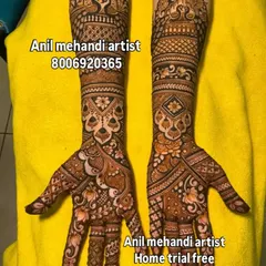 This design showcases a mix of bold floral patterns on the palm and intricate jaal (net) work on the arms. The contrast between the styles makes the design stand out.