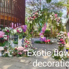 Another view of the enchanting birthday party entrance. The floral arch is complemented by pink and purple balloons, creating a perfect welcome for a magical celebration.