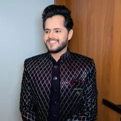 A happy groom in his intricately designed reception sherwani. My job was to ensure his face looked as sharp and detailed as his outfit, using HD makeup for a flawless finish.