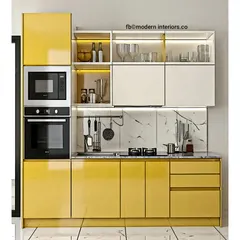 Another look at a straight kitchen layout, this design is perfect for smaller apartments. The bright yellow cabinets bring energy to the space, while the marble-patterned backsplash adds a touch of elegance.