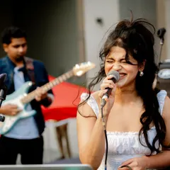 Feeling the music during a live duo performance with my guitarist. This was an incredible moment for me, opening for the band Swarathma at a large outdoor festival.