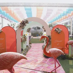 A whimsical entrance for a pastel carnival. I used playful flamingo figures, a pink patterned aisle, and soft, arched doorways to welcome guests into a world of fun and fantasy.