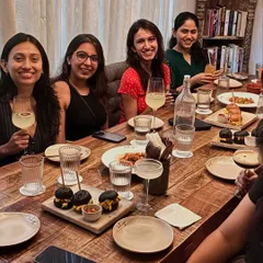 Our community dinners are filled with laughter and stories. Here, a group of clients enjoys a well-deserved meal, sharing drinks and food. This is where we unwind and the community spirit truly shines.