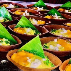 A beautiful display of my mango desserts, each served in an earthen pot and garnished with a banana leaf. This presentation style is both eco-friendly and aesthetically pleasing.